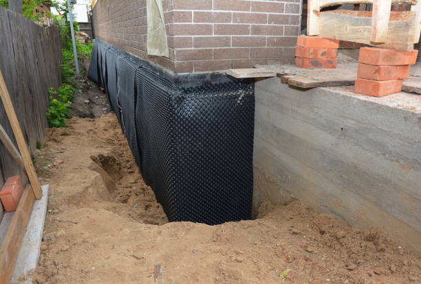 Happy homeowners after waterproofing job in Bohemia